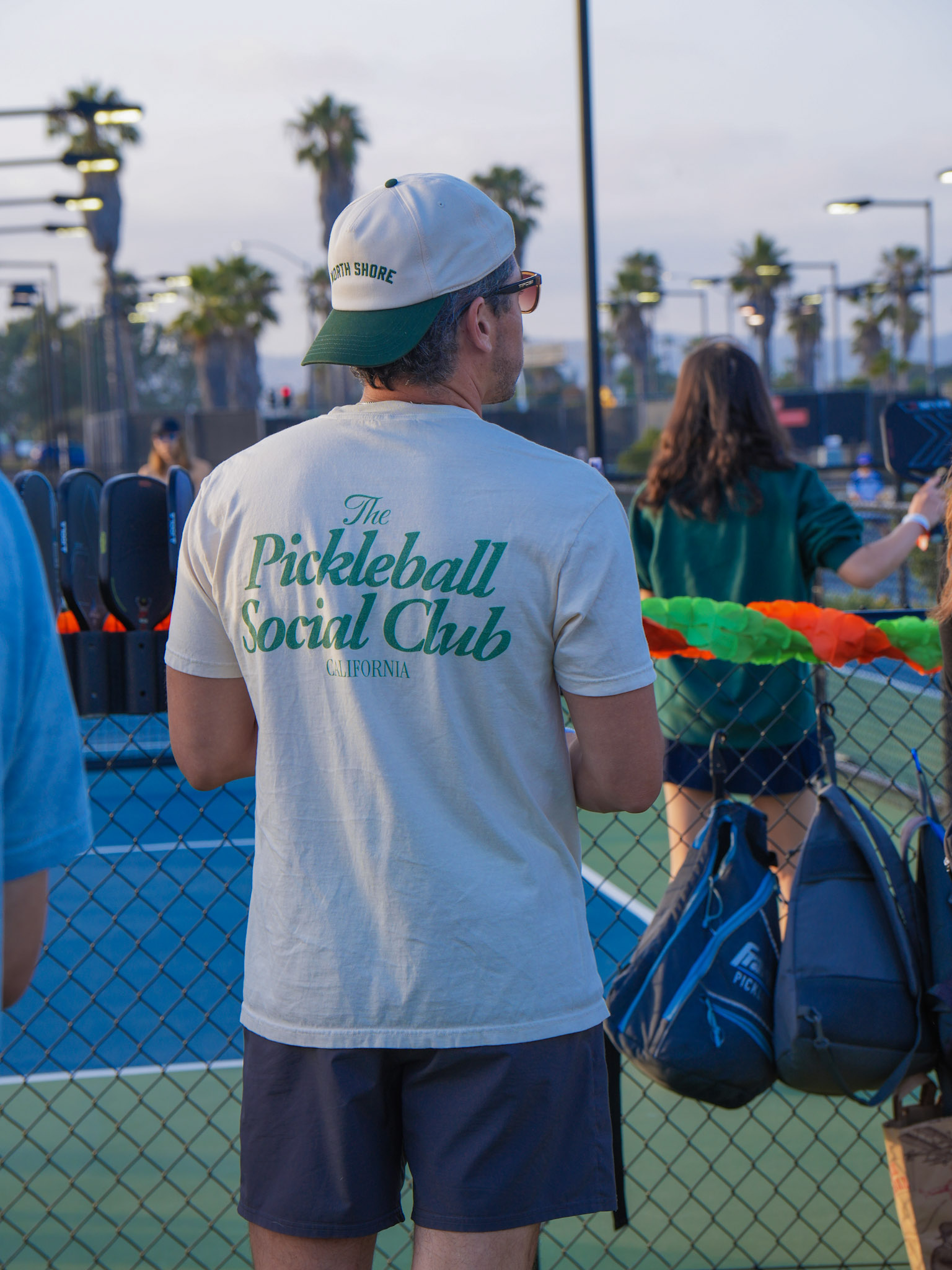 Pickleball Social Club event at outdoor courts in California at dusk