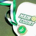 Pickleball players tracking scores in a round robin tournament with Main Court's free pickleball round robin app